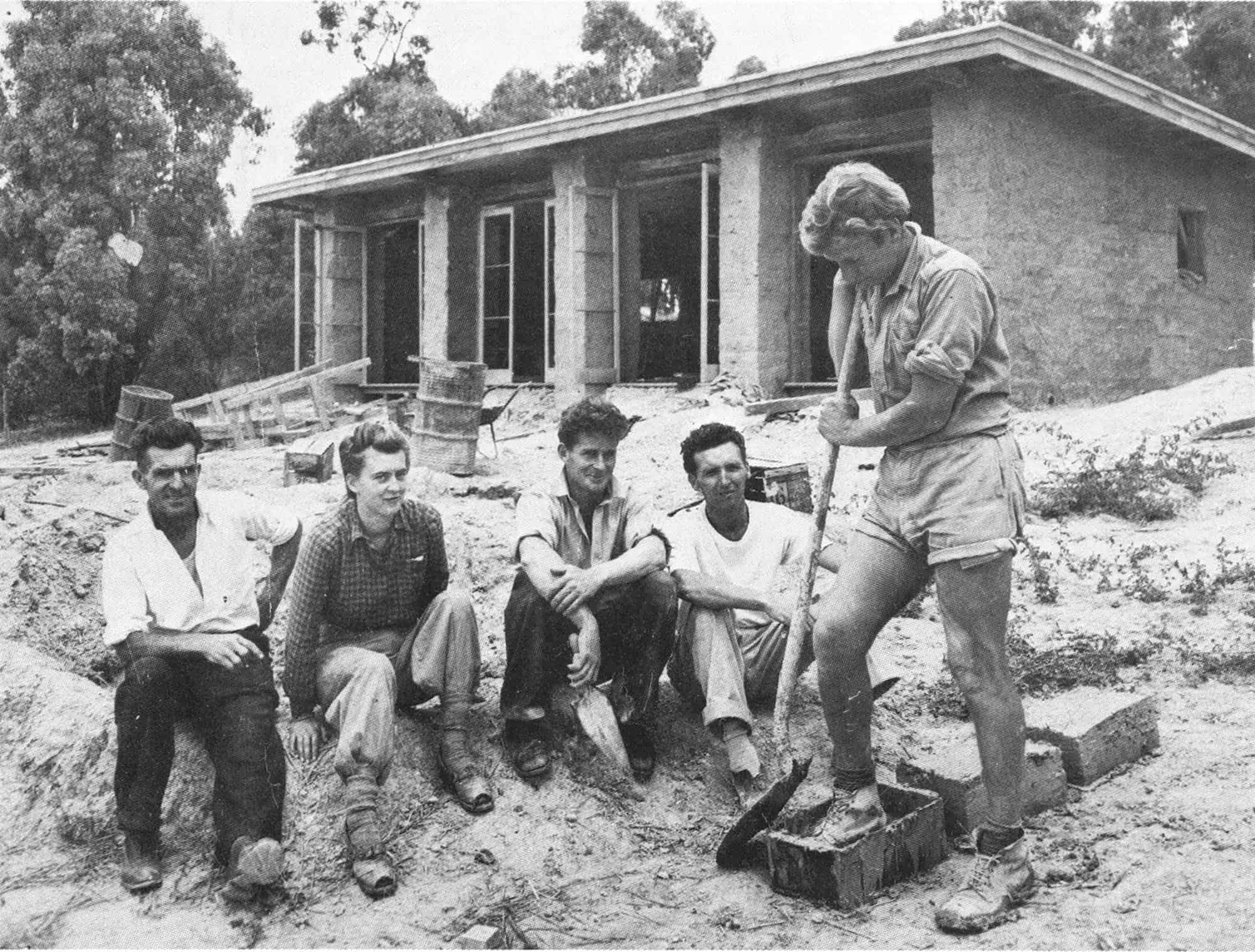 The first mud brick building, 1947. <b>Left to Right</b>: L.Mayfield, carpenter; Sonia Skipper; Alistair Knox; Tony Jackson; Gordon Ford with the English house in the background