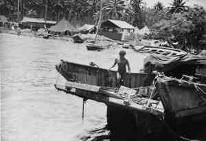 Milne Bay. Japanese invasion barges destroyed by fighter aircraft of the Royal Australian Air Force during the Japanese landing in 1942